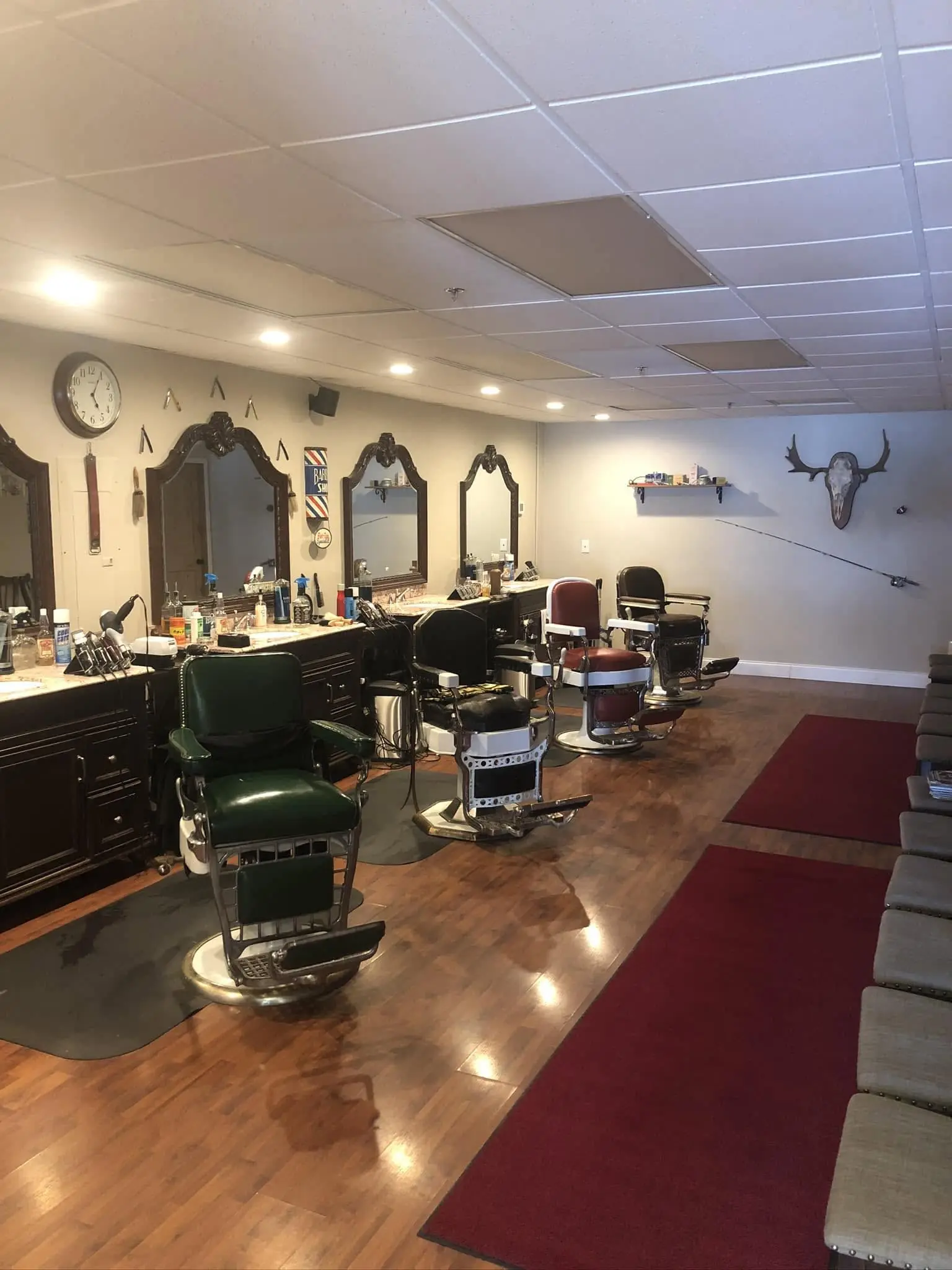 Inside TL Slicks Barbershop & Shave Parlor in Kalispell — vintage decor and antique barber chairs